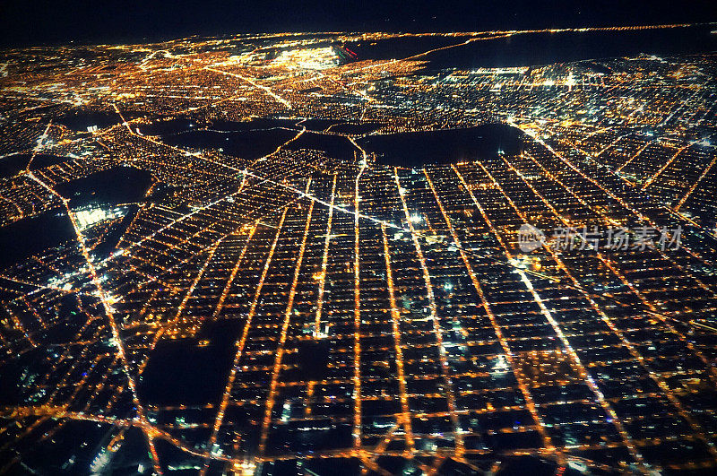 Aerial View of Sprawling NYC Grid Lights, NY at Sunrise